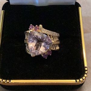 Triangular CZ Ring with a few amethyst stones in a gold setting, size 6.